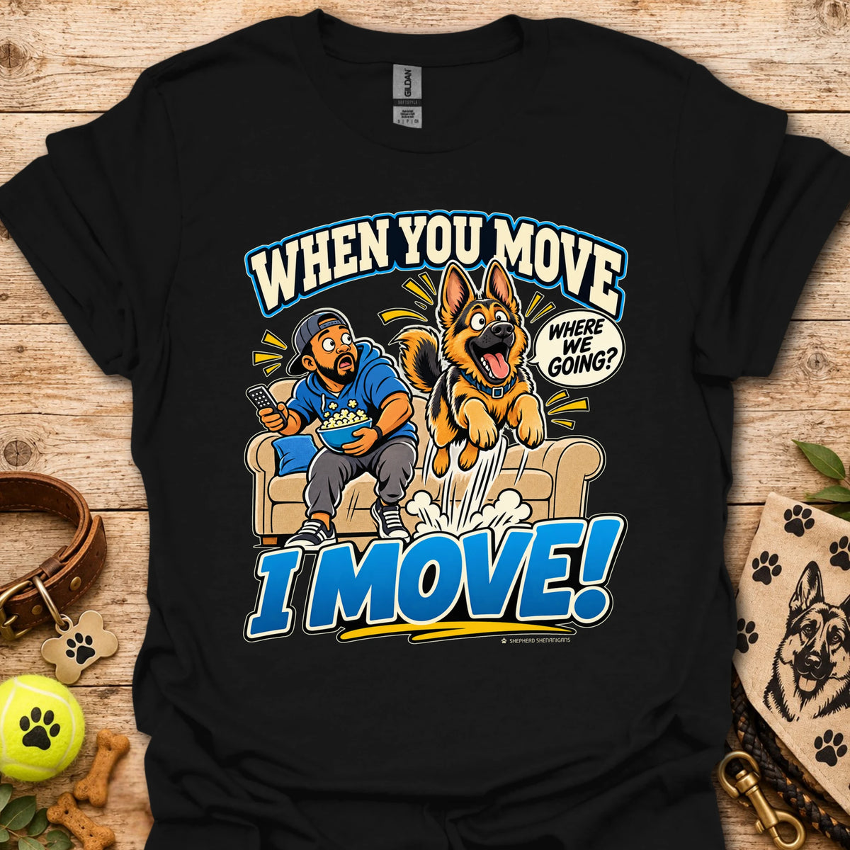 Black T-shirt with a cartoon man and dog leaping from a couch and bold slogan text.