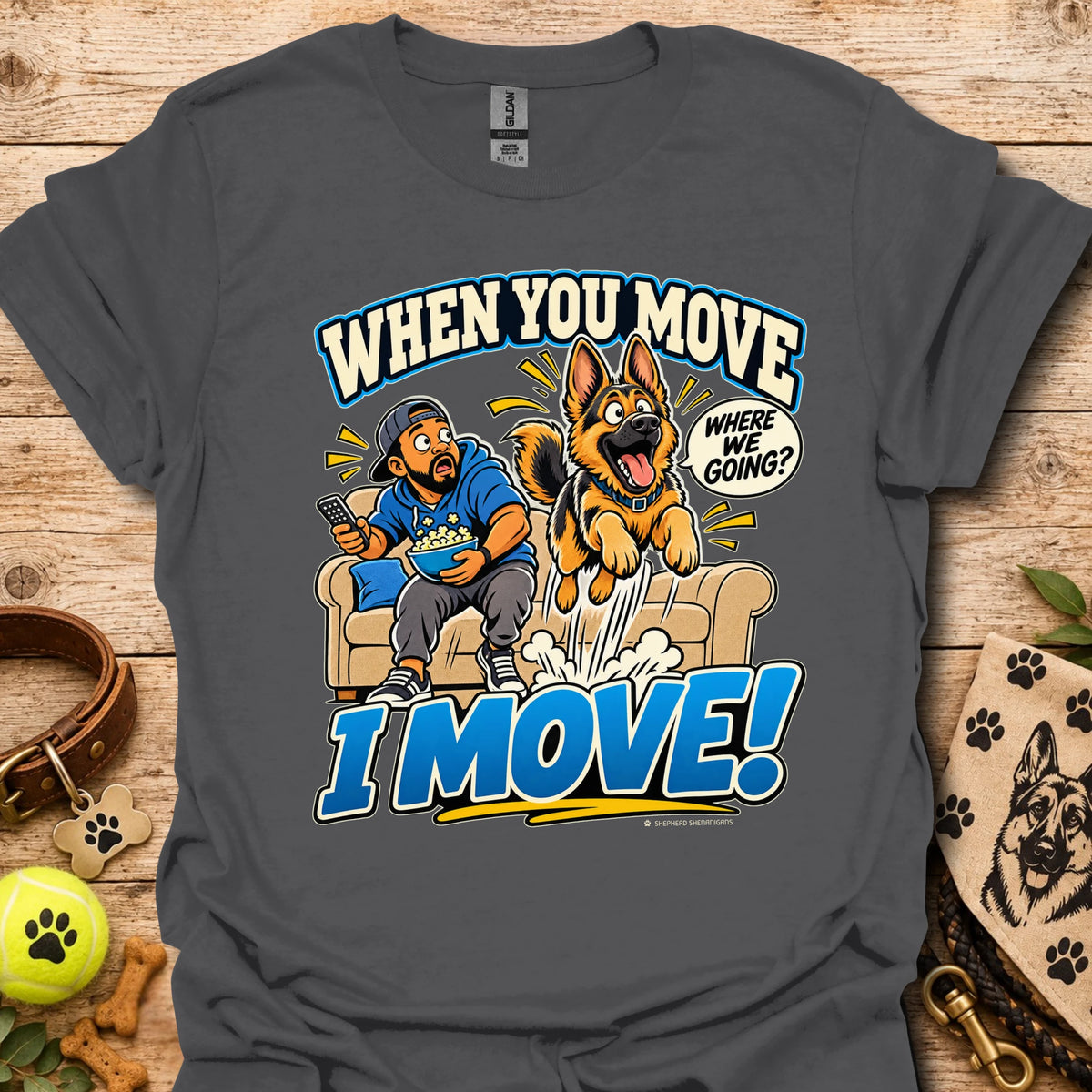 Charcoal T-shirt with a cartoon man and dog leaping from a couch and bold slogan text.
