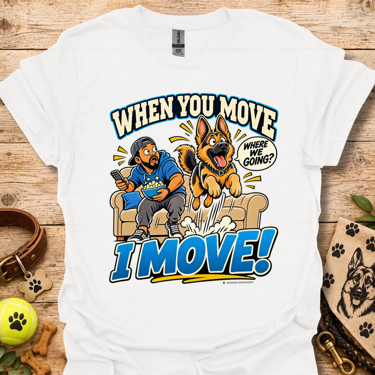 White T-shirt with a cartoon man and dog leaping from a couch and bold slogan text.