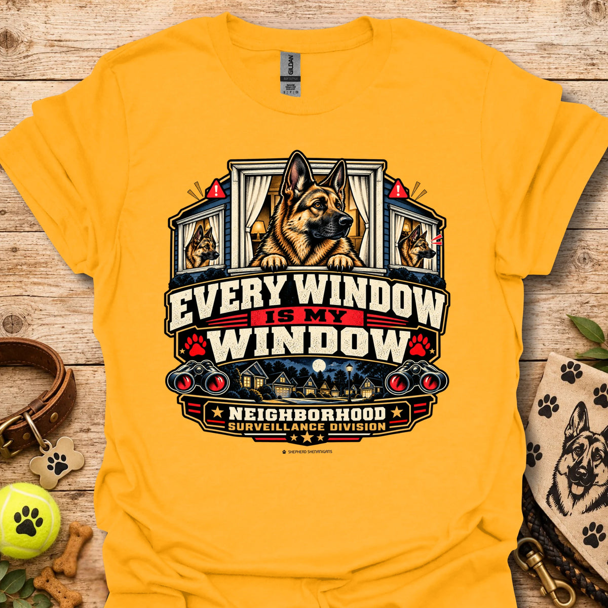 Gold window-surveillance graphic t-shirt with dog in window and slogan artwork